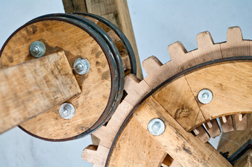 historical gears in wood and metal with wheels and teeth