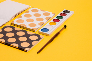 The many notebooks on colored table. memo and planning concept.