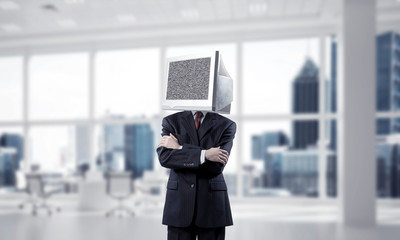 Businessman with monitor instead of head.