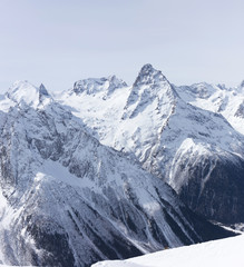 Fototapeta na wymiar Mountain winter landscape with white peaks.