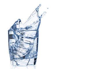Pure water splashing out of glass on white background