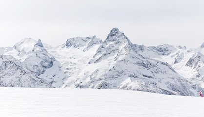 Mountain winter landscape with white peaks.