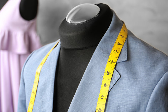 Custom-made suit on mannequin in atelier, closeup