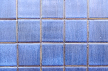 Background of blue square tiles on the wall and pool of the pool