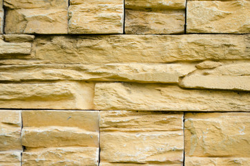 Background of yellow brick stone wall