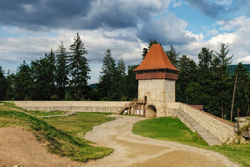 Fototapeta na wymiar Panoramic view of the inner courtyard of the Rasnov Fortress under cloudy sky, Rasnov city, Brasov county, Romania