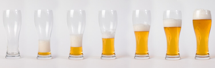 Lager beer in glass. Steps of filling glass of beer.