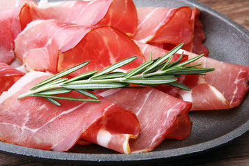 prosciutto with rosemary  or ham of black forest or serrano.