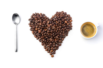 spoon, coffe beans and cup of coffe