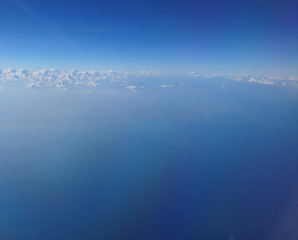 Fototapeta premium Clouds on the sky in the aircraft illuminator
