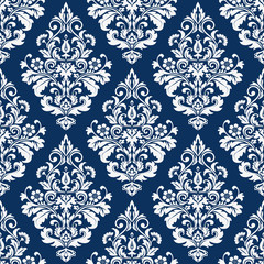 Floral pattern. Wallpaper baroque, damask. Seamless vector background. Dark blue and white ornament.