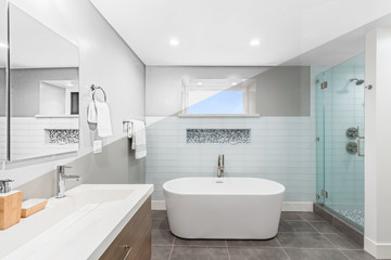 Fototapeta na wymiar Illustration Drawing diagonal Split screen to Photograph of Luxury bathroom interior with an oval bathtub stone tiles and with glass shower.