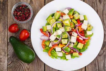Delicious salad with avocado, feta and sweet pepper