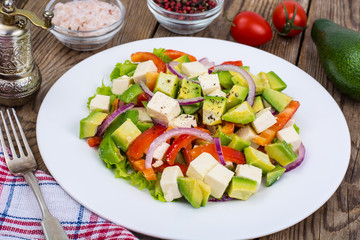 Delicious salad with avocado, feta and sweet pepper
