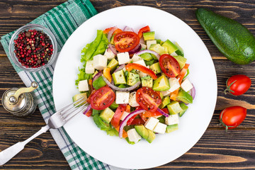 Dietary salad of fresh vegetables with avocado and goat cheese