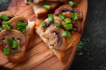 Crostini with mushrooms and green onion.