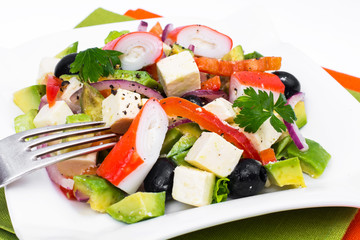 Vegetable salad with avocado, surimi and fetus