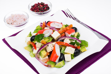 Vegetable salad with avocado, surimi and fetus