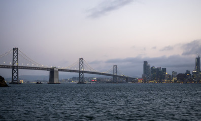 Fototapeta premium Oakland Bay Bridge, sunset skyline - San Francisco, SF, California, CA, USA