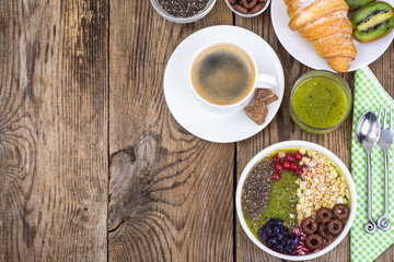 Espresso, croissant and fruit dessert for breakfast