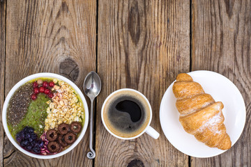 Espresso, croissant and fruit dessert for breakfast