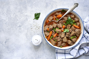 Beef stew with vegetables garnished with boiled rice.Top view.