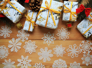 Christmas background with fir branches and gifts.