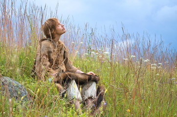 man dressed as a medieval peasant in the field