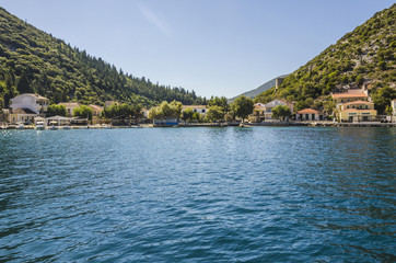 Fototapeta na wymiar Bay and in the background the harbor of Frikes over the Ionian sea on the island of Ithaka