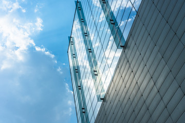 Modern office building against blue sky.