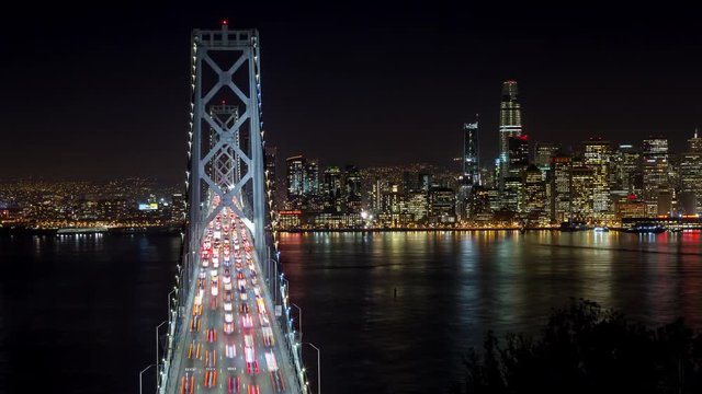 San Francisco Oakland Bay Bridge and Downtown at Night Panning Timelapse