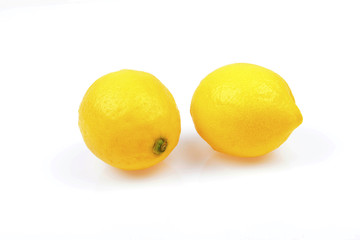 Two fresh lemon isolated on a white background