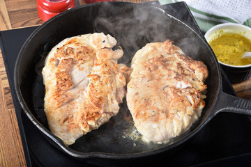 Frying chicken breasts
