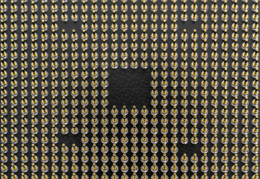 Pin Grid Array Angled - Bottom Of Computer Microprocessor - Closeup View Of The Pins On The Under Side Of A Central Processing Unit (CPU) Made For Desktop Computers