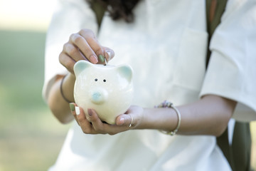 Woman Holding Piggy Bank. People Save Money Concept.