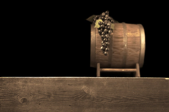 Rustic toning blurred wooden barrel on a night background