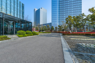 city empty traffic road with cityscape in background.