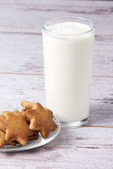 Gingerbread Cookie. Glass milk. Light background