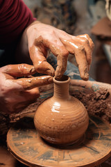 Potter at work. Workshop place.