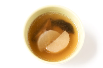 Bowl of pork bone with shiitake mushroom and radish soup isolated on white background.