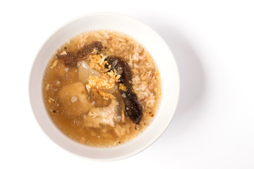 Bowl of boiled rice pork bone with shiitake mushroom isolated on white background.