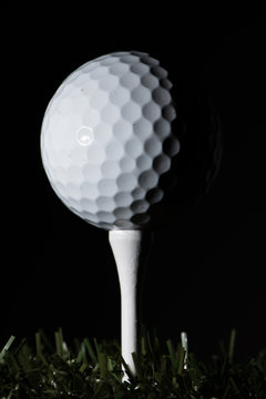 Golf ball standing on tee