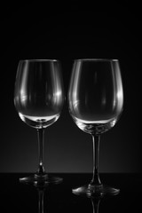 Two upright empty wine glass