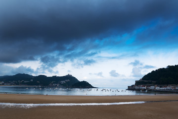 La Concha bay and dark sky, Donostia, Spain.