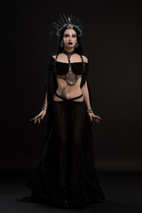Woman in gothic suit and silver crown