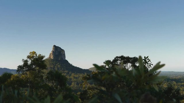 dolly shot of mount coonowrin in the glass house mountains national park