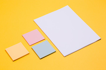 The many empty paper clips, yellow background