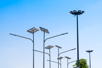 LED street light with solar cell, electric spot light in blue sky background. Green energy concept.