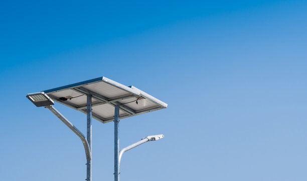 LED street light with solar cell in blue sky background. Green energy concept. concept.
