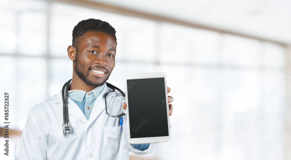 Poster African american doctor with a stethoscope standing against blurred background